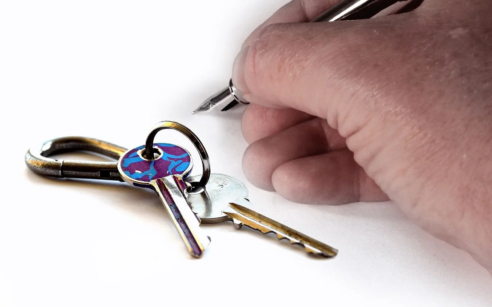 Hand, key and house keys