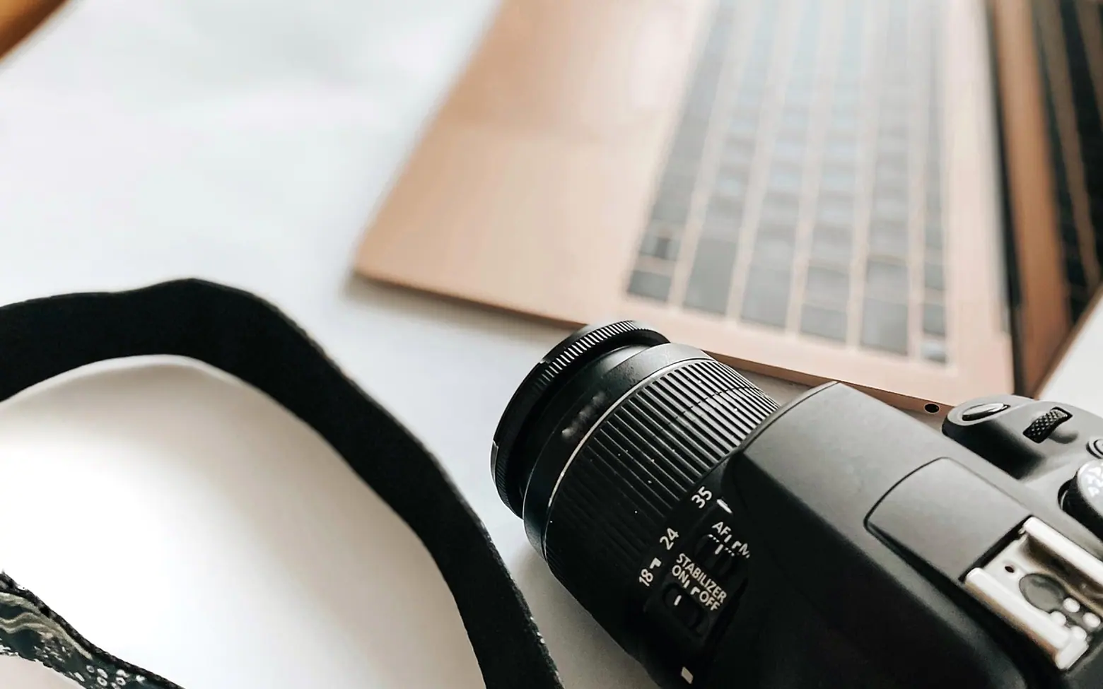 Laptop, camera and desk